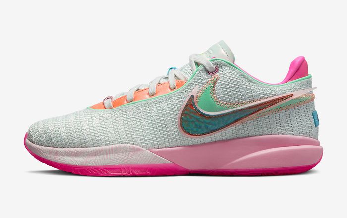 Best basketball shoes Nike product image of a light green mesh sneaker with pink accents.