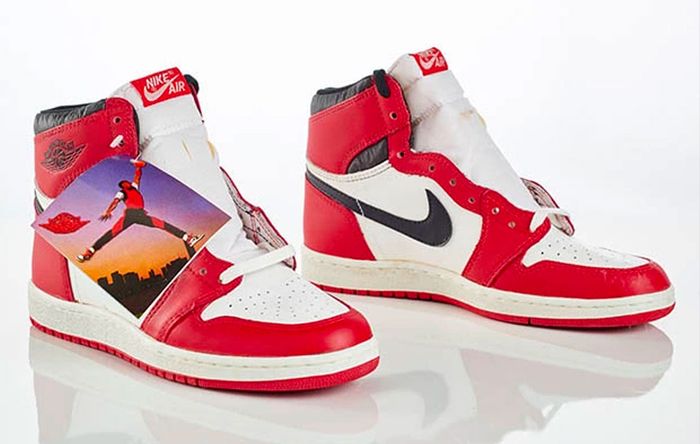 Original Jordan 1 High product image of white and red sneakers unlaced.