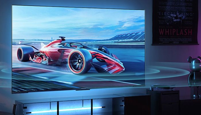 Latest TV news Hisense product image of a flat-screen TV with a F1-inspired racing car on the display.