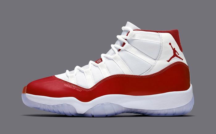 Upcoming Air Jordan 11 colorways "Cherry" image of a single white sneaker with a metallic, Cherry Red mudguard.