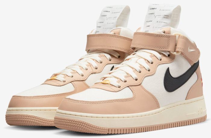 Nike Air Force 1 "Pale Ivory" product image of a pale pink and white pair of high-tops with special edition tongues.