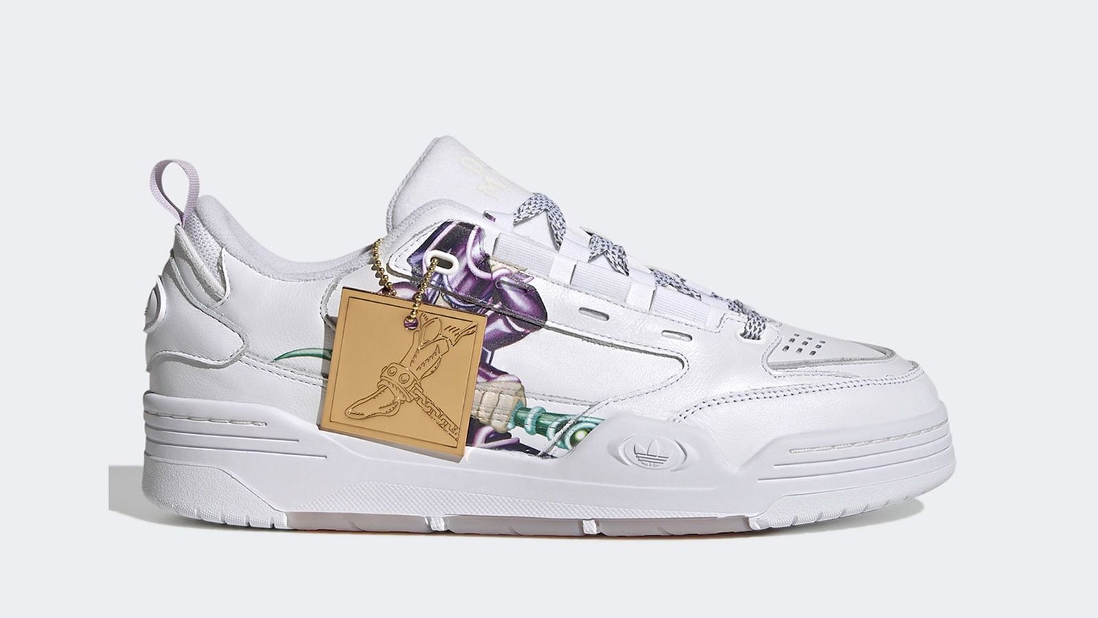 Yu-Gi-Oh! x adidas ADI2000 product image of a white sneaker with a graphic of Dark Magician on the side and a golden hang tag.