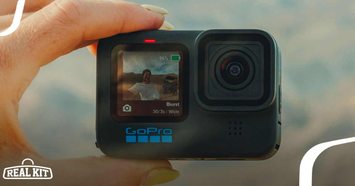 Image of a black GoPro in-hand facing the person.