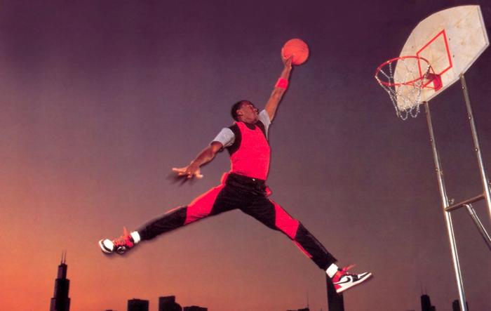 Originally Jordan Jumpman logo from 1985 with Jordan jumping in the air in a symmetrical pose.
