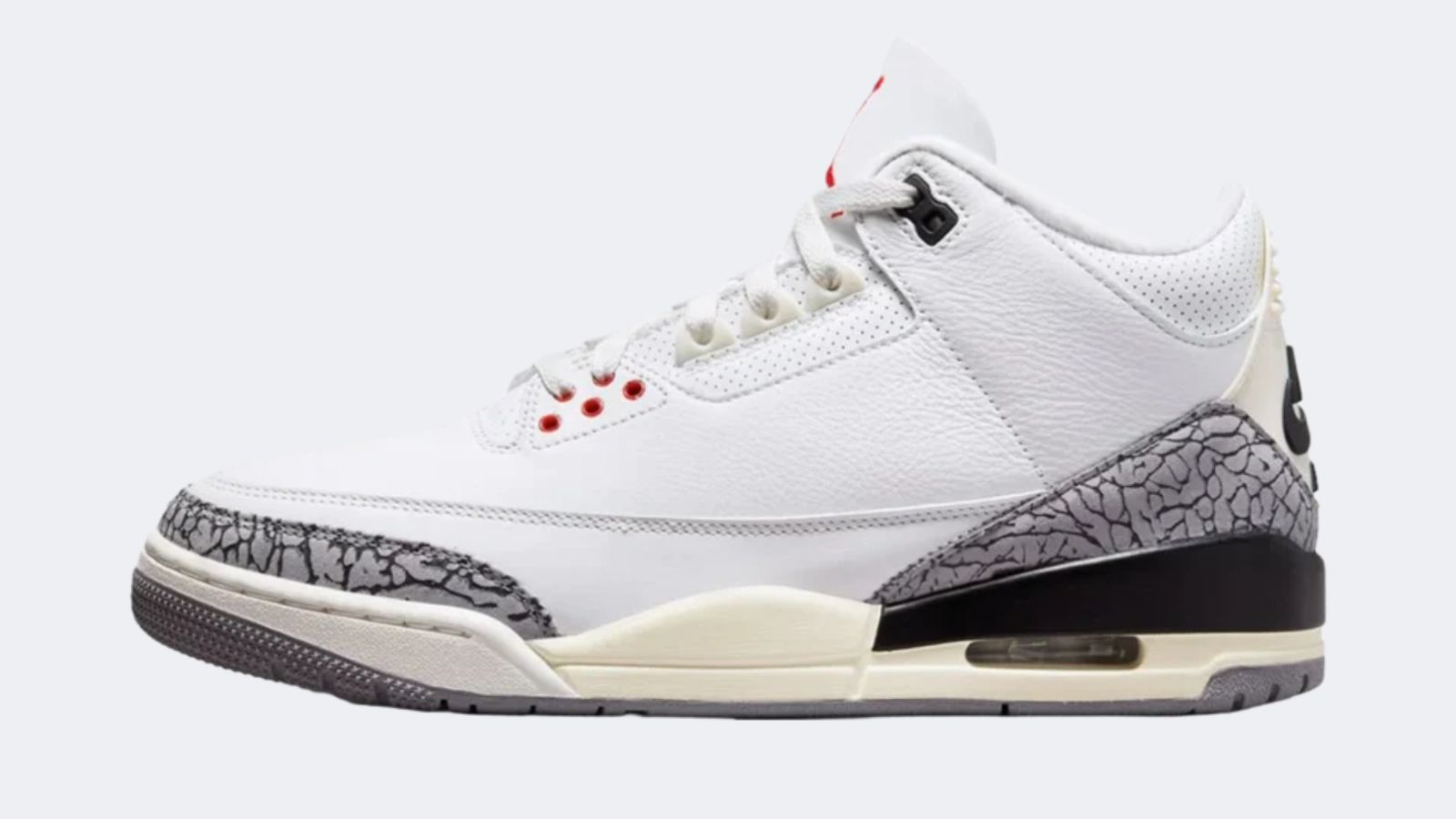 Air Jordan 3 Reimagined "White Cement" product image of a white sneaker featuring a pre-aged midsole, elephant print overlays, and red details.