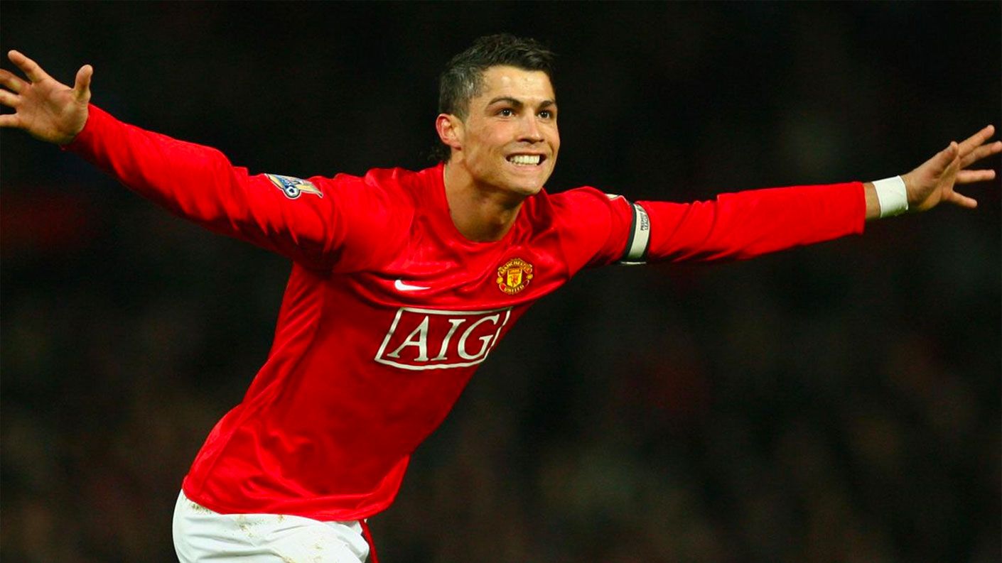 Manchester United Nike 2007/08 kit image of Ronaldo celebrating wearing a plain red kit with white shorts.