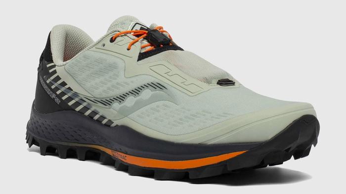Best Winter running shoes Saucony product image of a single grey/green shoe with a black midsole and orange details.