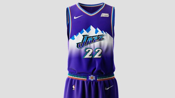 Utah Jazz Classic Edition Jersey product image of a purple sleeveless uniform with a white and blue mountain range graphic on the front