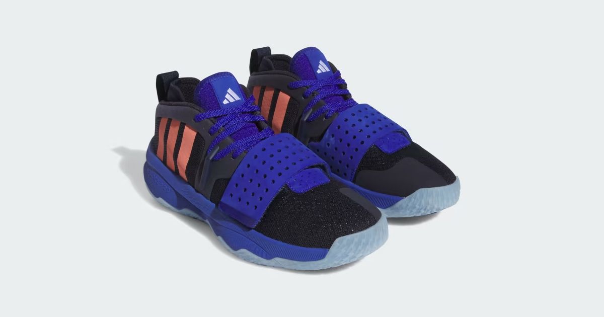 A pair of black adidas basketball shoes featuring purple trim, laces, and toebox straps, orange stripes down the sides, and light blue outsoles.