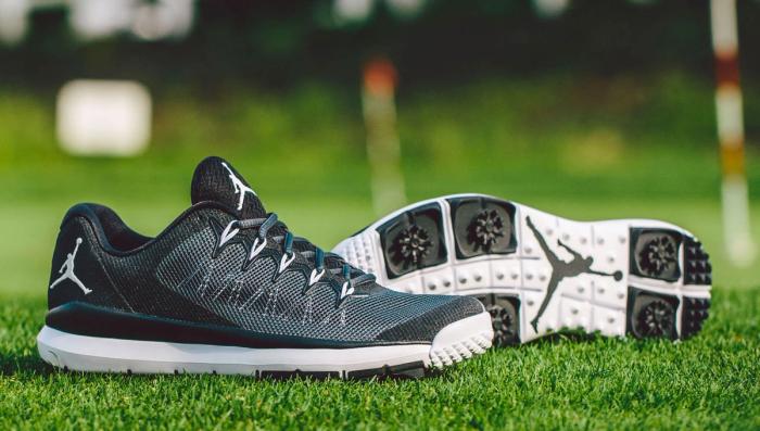 Best Jordan golf shoes Jordan Flight Runner product image of a pair of black and dark grey golf cleats.