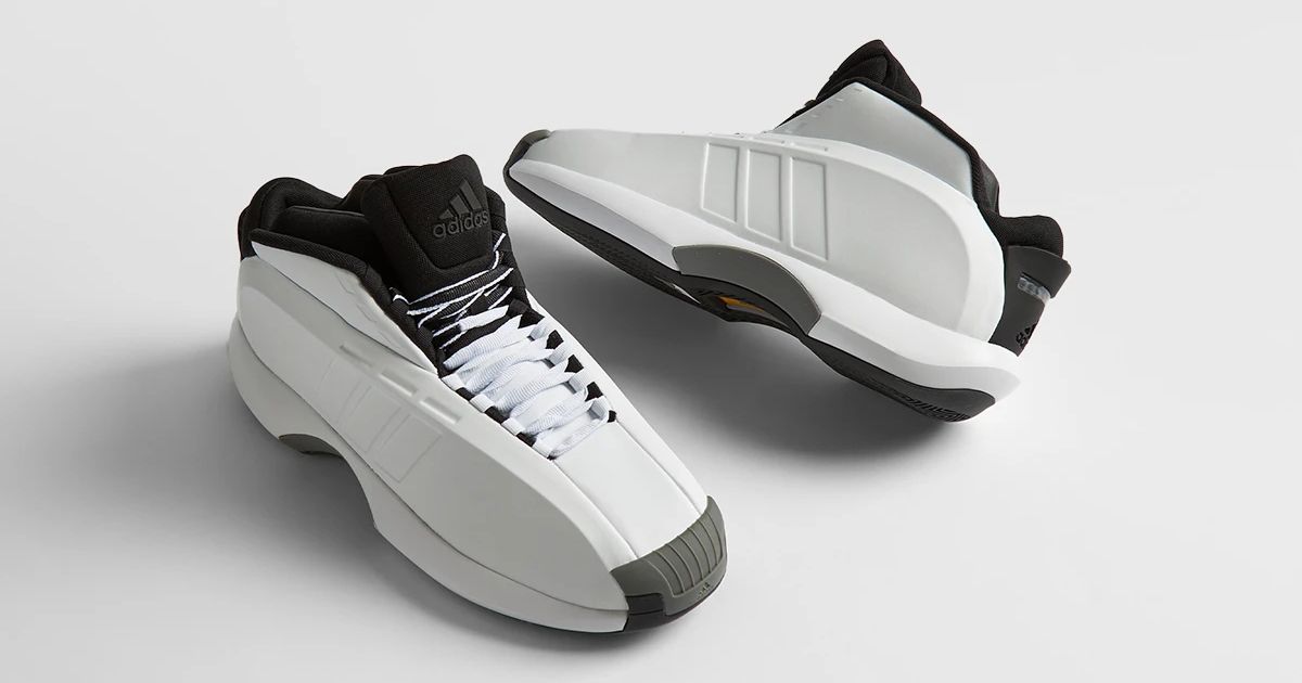 A pair of boxy white adidas Crazy 1 basketball shoes with gray and black details.