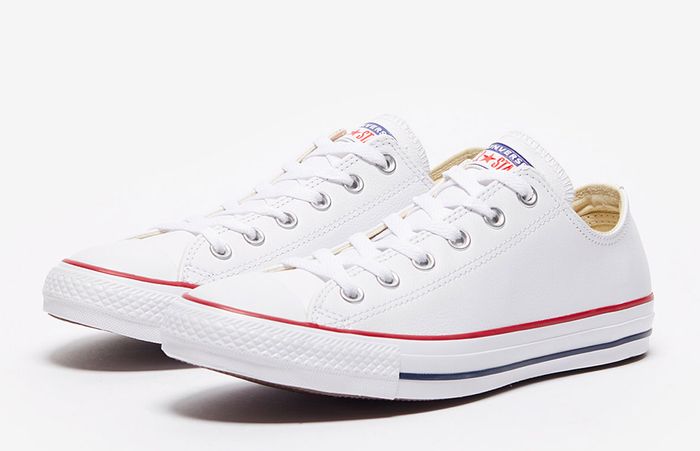 Converse product image of white Chuck Taylor All Star's with red and blue accents.
