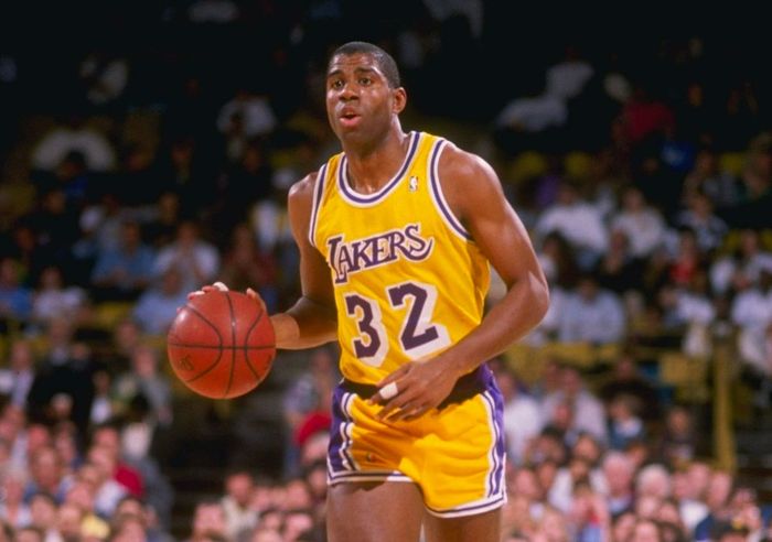 Best NBA jerseys of all time Los Angeles product image of Magic Johnson wearing a yellow strip with purple details.