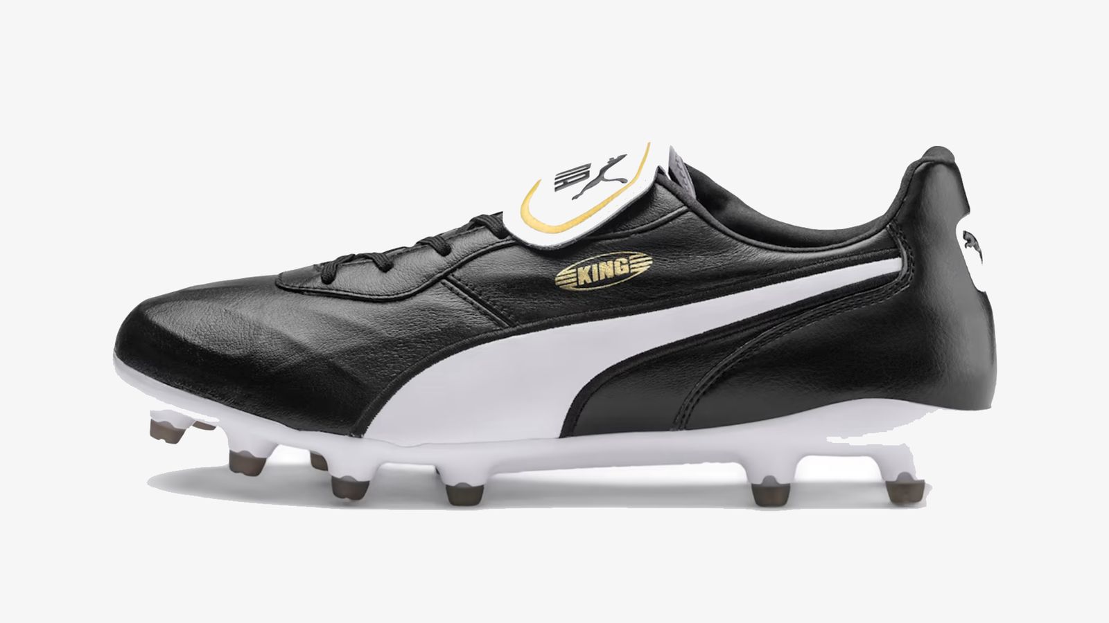 PUMA King Top product image of a black and white PUMA boot featuring gold branding.