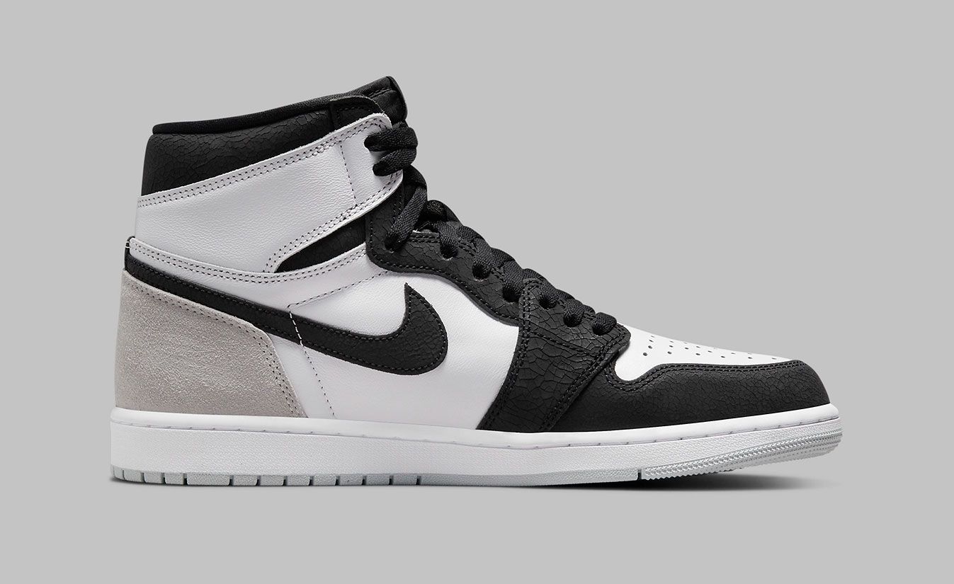 Air Jordan 1 "Stage Haze" product image of a white, black, and grey sneaker.