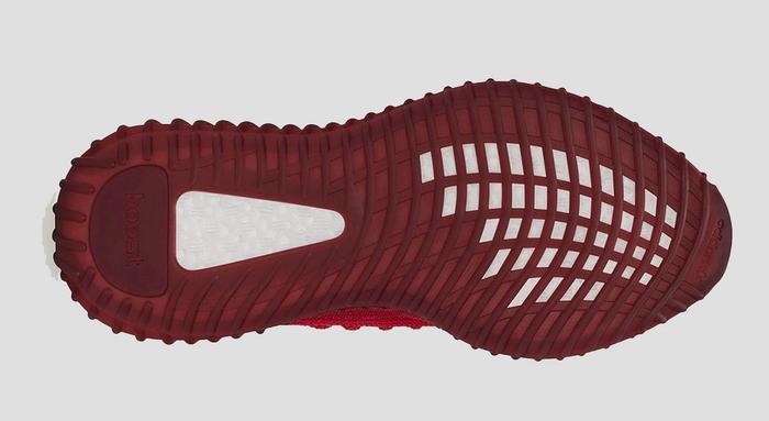 Yeezy Boost "Slate Red" in-hand image of an all-red sneaker.