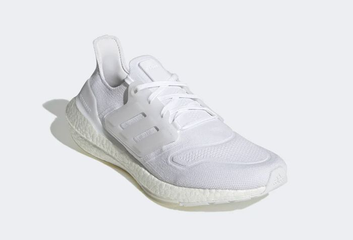 adidas Ultraboost 22 product image of an all-white knitted sneaker.