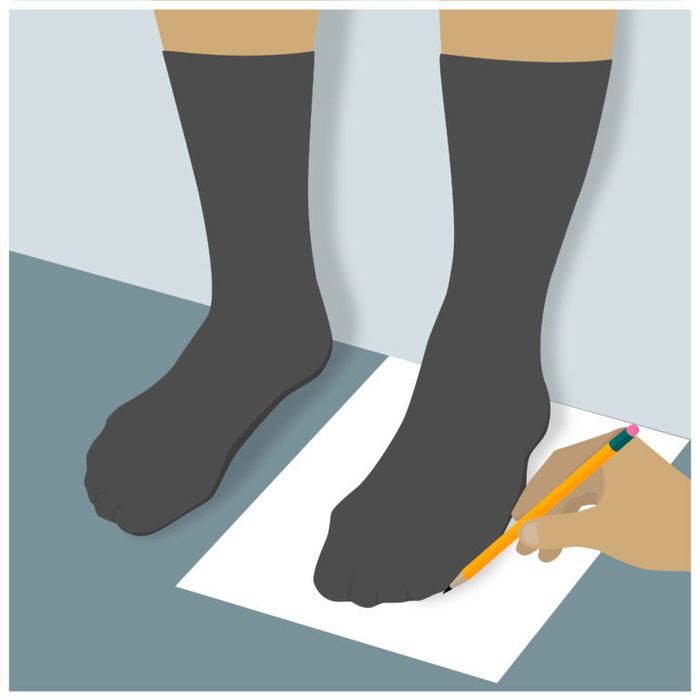 Image of someone tracing around their left foot on paper.