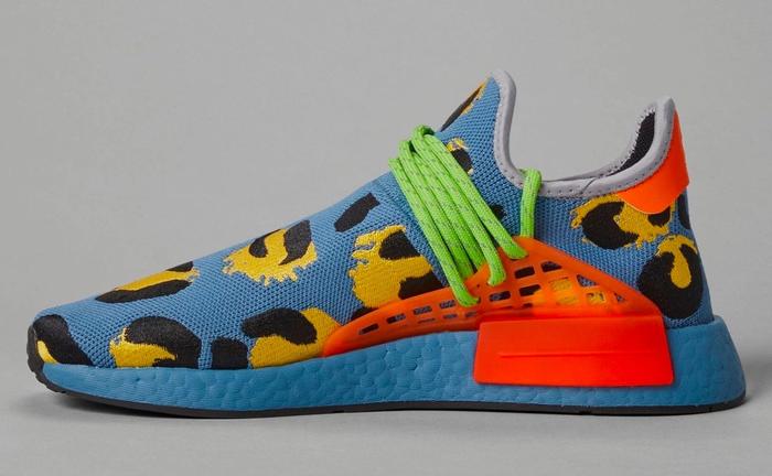 Pharrell x adidas Hu NMD Animal Print Blue product image of a blue sneaker with orange accents, green laces, and yellow and black animal spots.