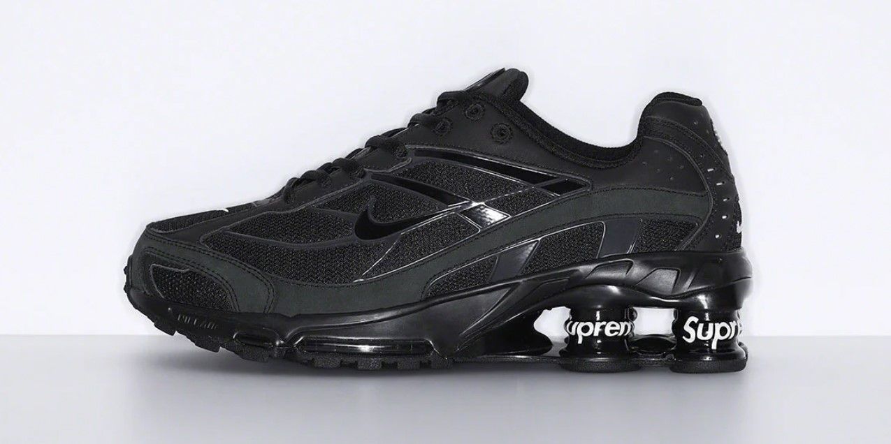 Supreme x Nike Shox Ride 2 product image of a black pair of sneakers with Supreme-branded cushioning columns in the heels.