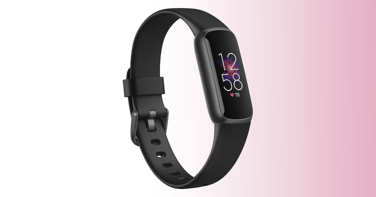 A black, band-like smartwatch with the time 12:58 on the display and the watch itself in front of a white and pink gradient background.