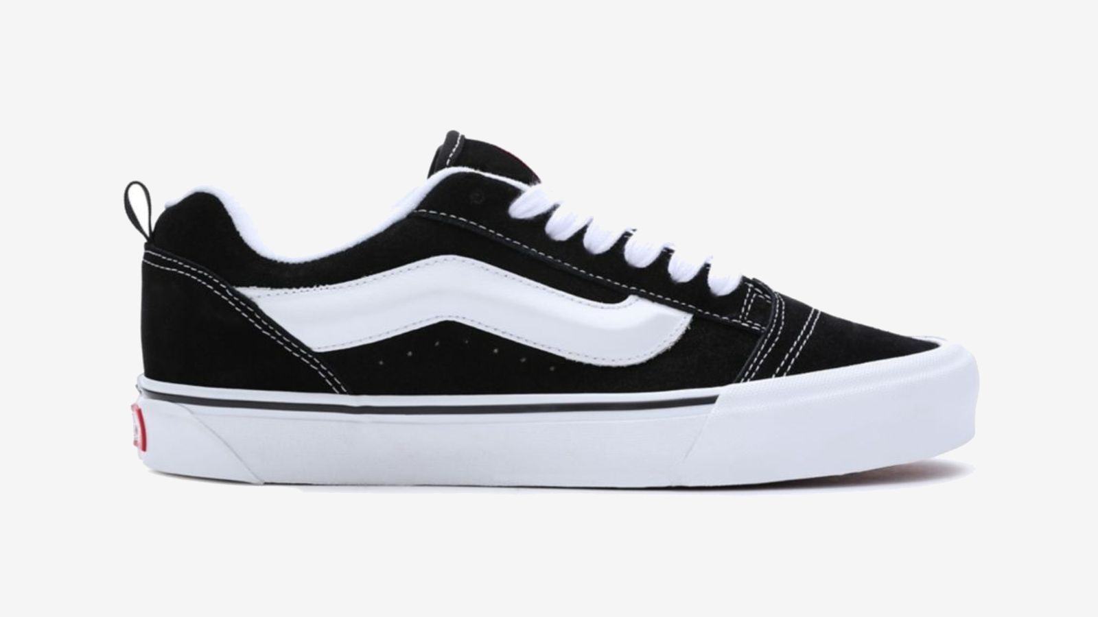 Vans Knu Skool "Black White" product image of a black Van low-top featuring oversized white details and midsole.