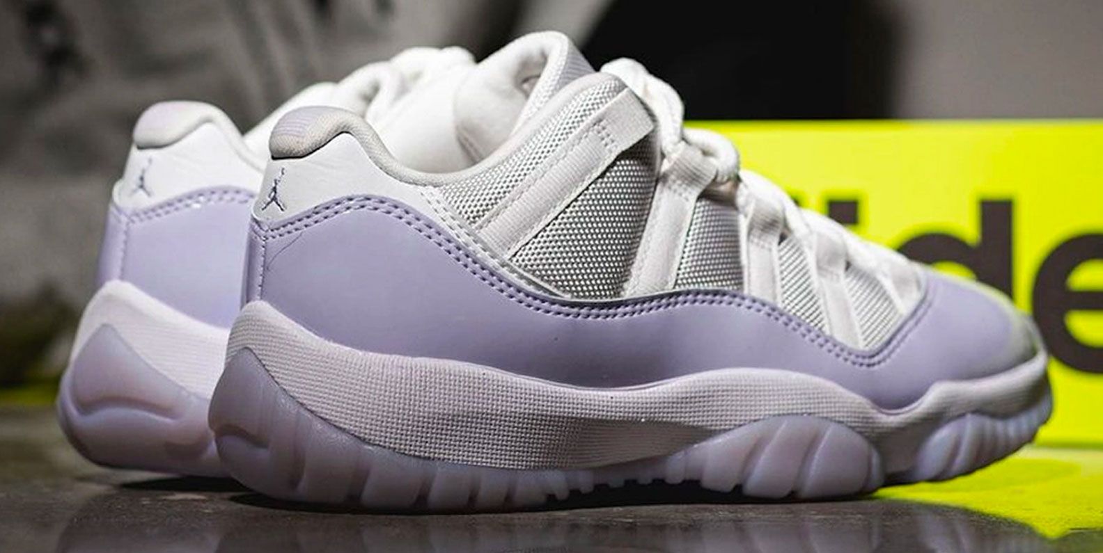 white and purple jordans 11