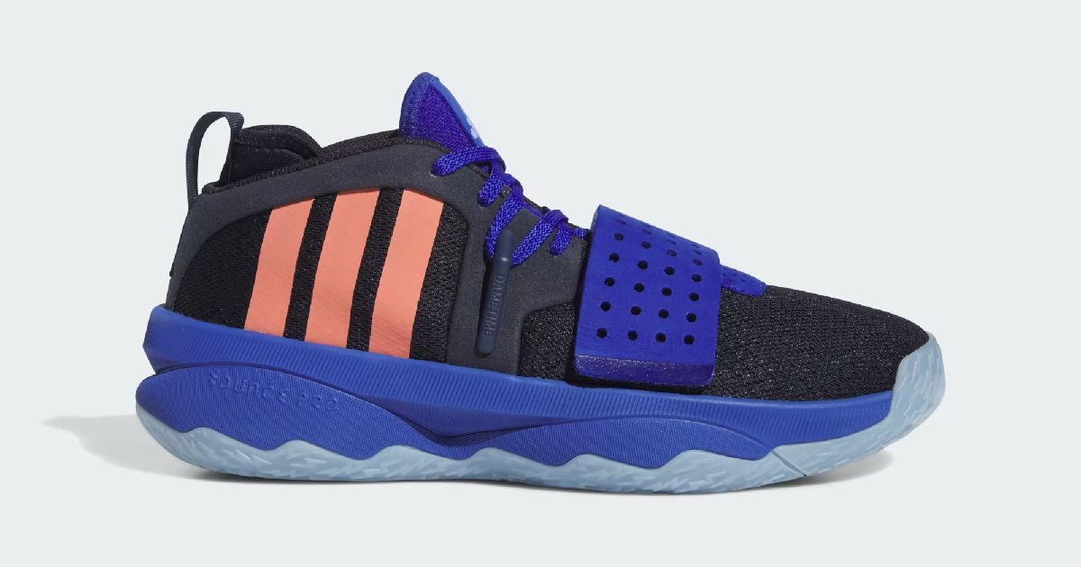 A black fabric and dark blue adidas Dame 8 EXTPLY sneaker featuring orange stripes down the side.