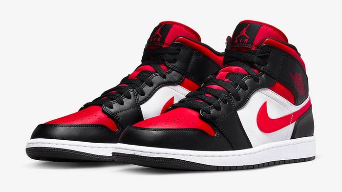 Air Jordan 1 Mid "Bred Toe White" product image of a pair of black, white, and red sneakers.
