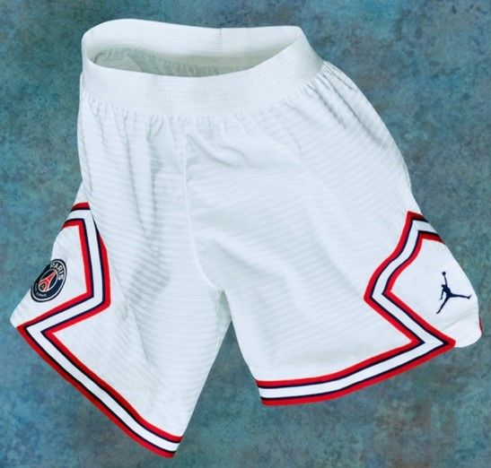 PSG fourth kit 2021/22 product image of a white Jordan-made shorts with blue and red details.