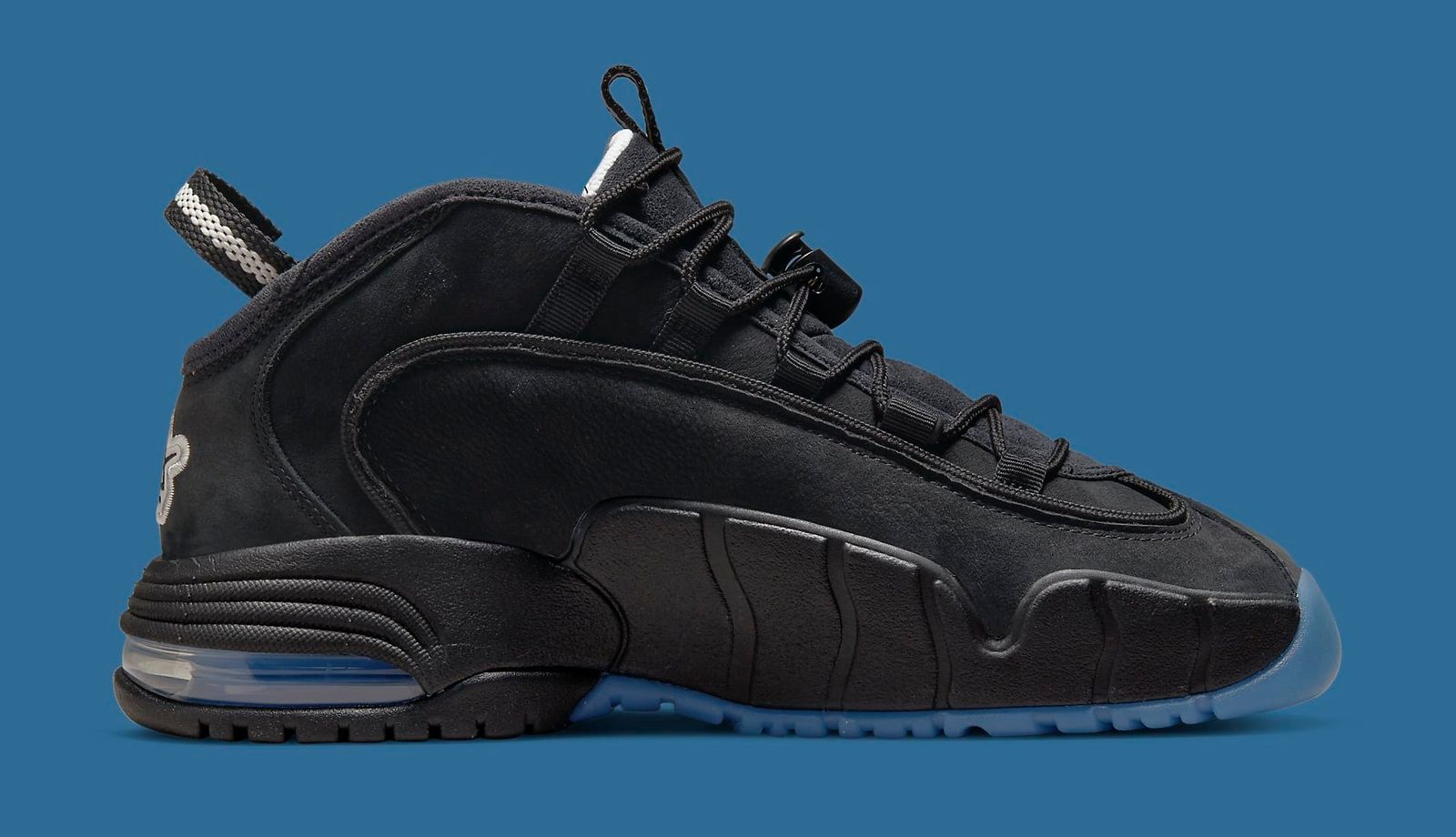 Social Status x Nike Air Max 1 Penny product image of a predominantly black coloured sneaker with white and black details and blue outsoles.