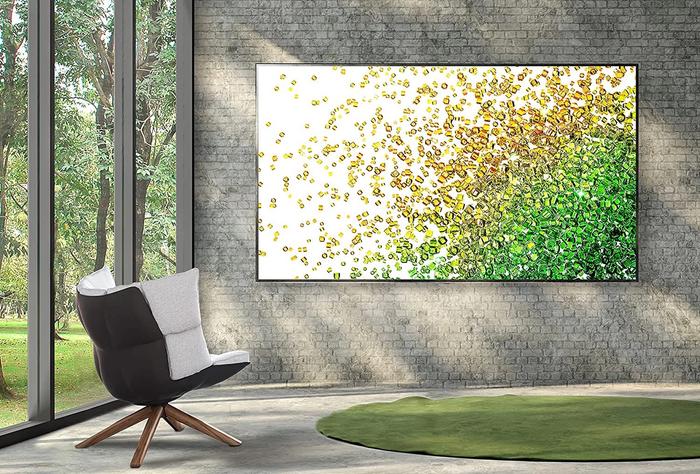 Best Black Friday deals LG product image a 50" TV mounted on a wall in a living room.