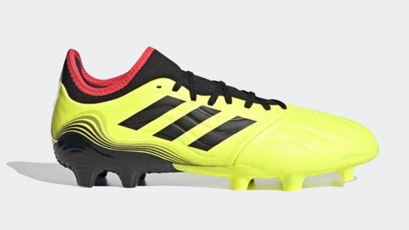 adidas Copa Sense.3 product image of a bright yellow and black boot with red lining.
