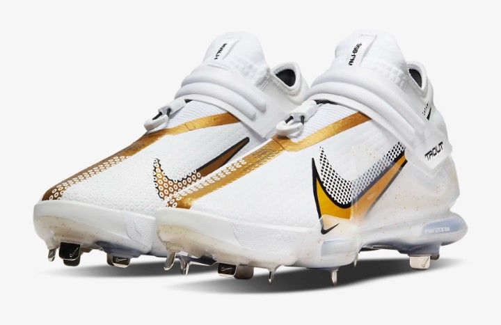 white and gold nike cleats