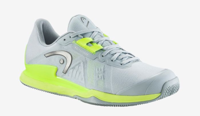 Best tennis shoes HEAD product image of a light grey shoe with yellow accents.