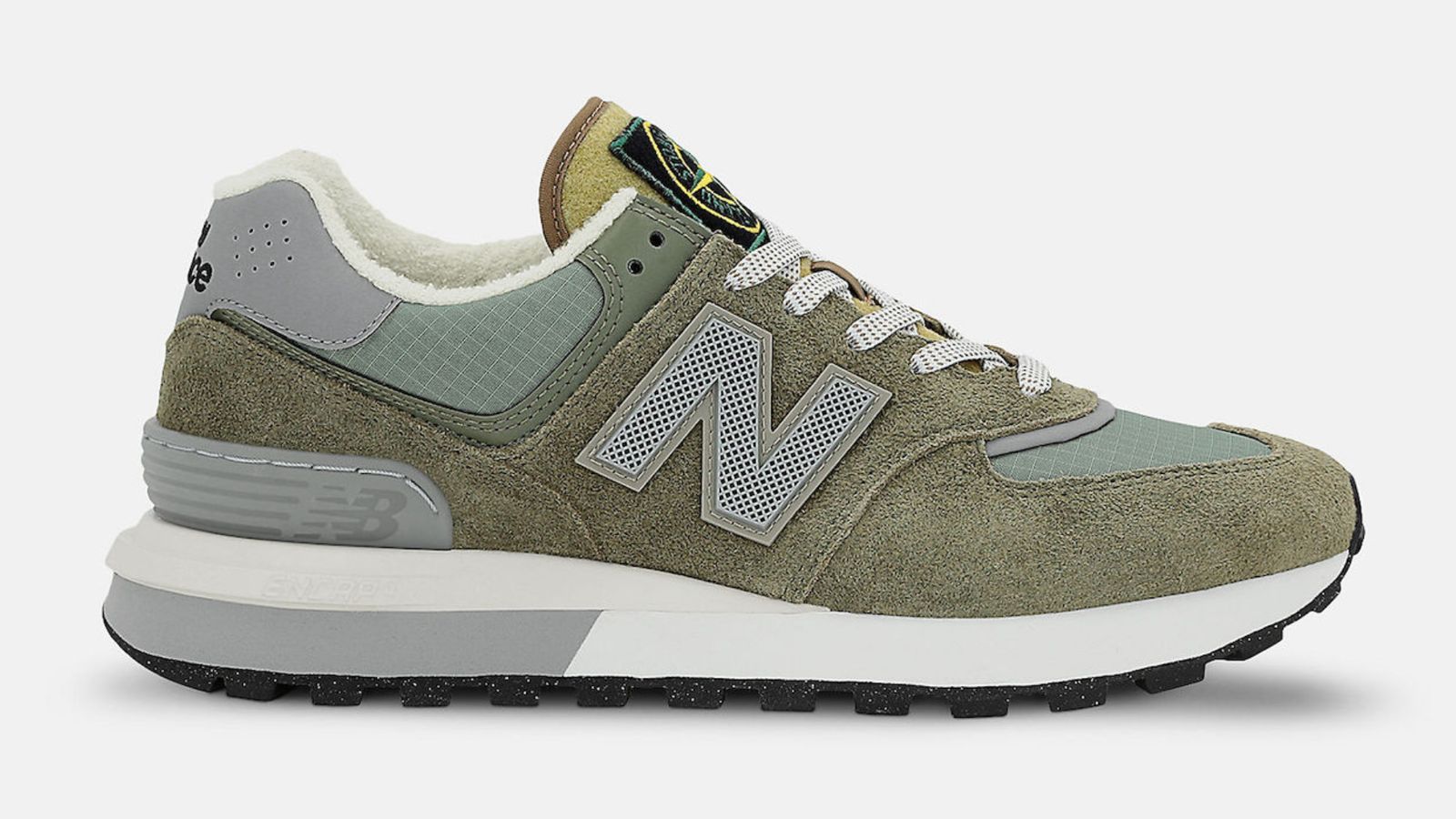 Stone Island x New Balance 574 Legacy "Steel Blue Green" shoes with a dark green hue constructed in a mix of ripstop and suede materials giving off a deconstructed archive inspired look