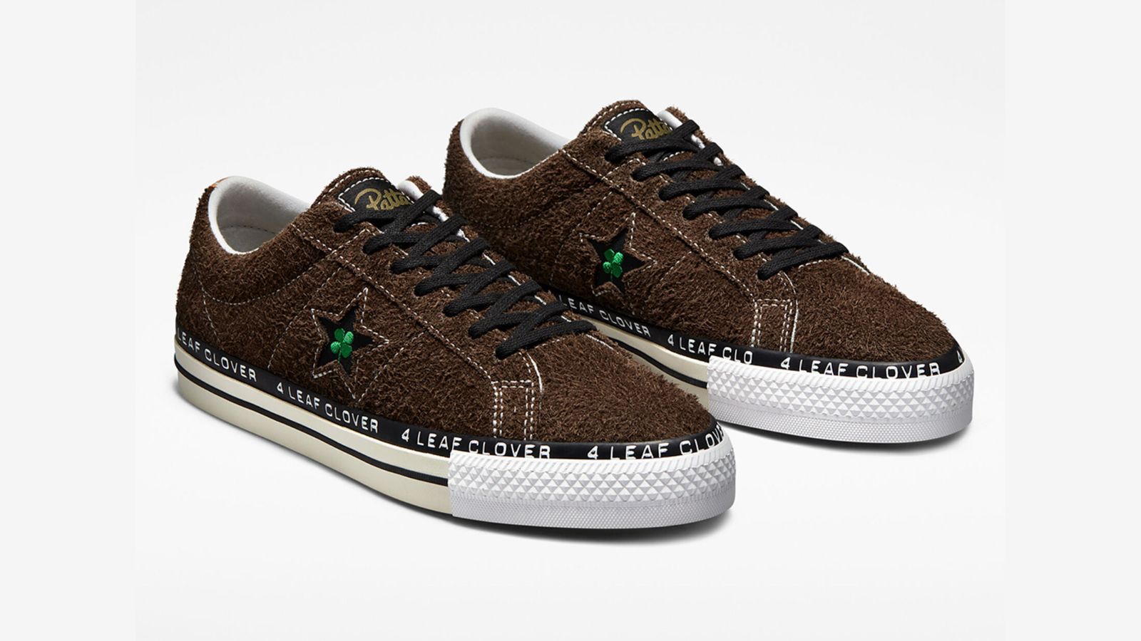 Patta x Converse One Star Pro "Four Leaf Clover" product image of a fluffy brown pair of shoes with white soles and featuring four leaf clover symbols in green on the sides.
