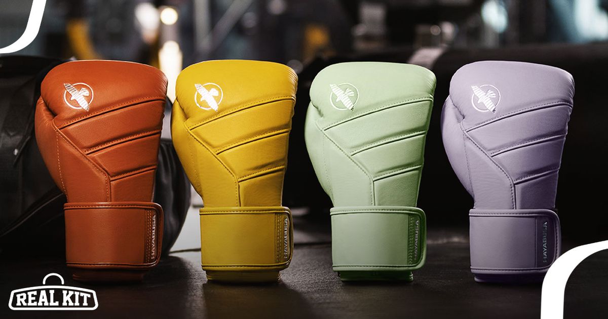 Four boxing gloves going from burnt orange, yellow, mint green, and light purple.