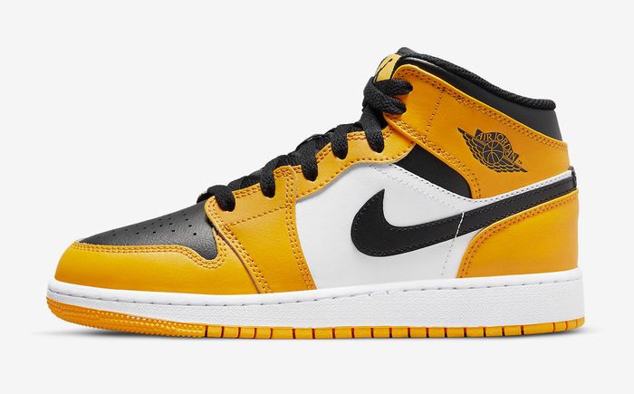 Best Air Jordan 1 "Taxi" product image of a pair of yellow, white, and black leather sneakers.