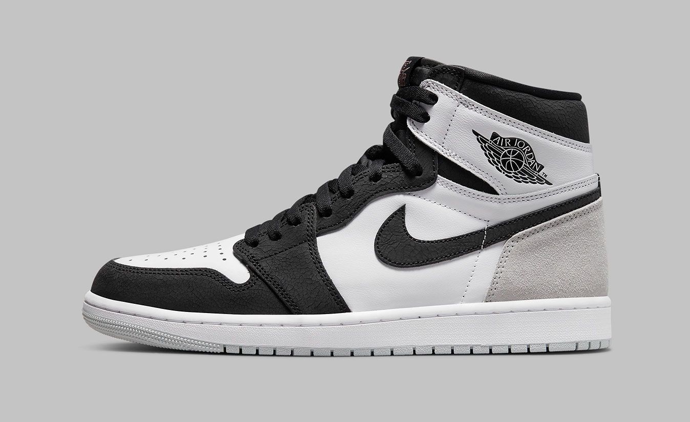 Air Jordan 1 "Stage Haze" product image of a white, black, and grey sneaker.