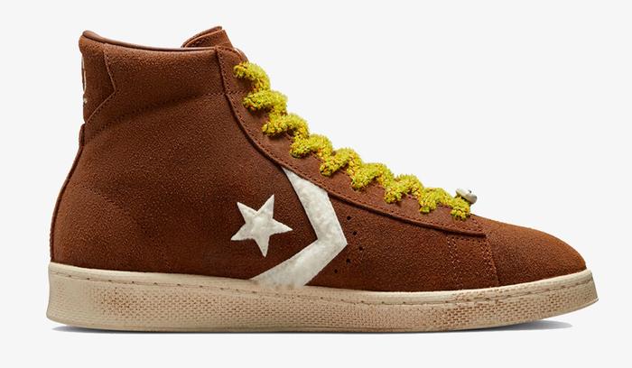 Best sneakers for fall Barriers x Converse Pro Leather High product image of a brown suede sneaker with yellow laces.