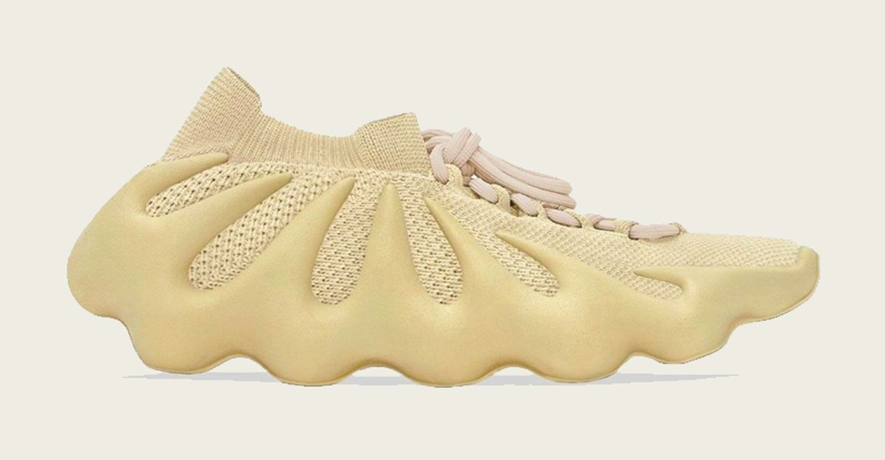 Best Yeezys 450 "Sulfur" product image of a yellow knitted sneaker with a large lattice sole.
