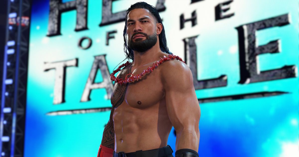 Roman Reigns in WWE 2K24 topless while wearing a red lei.