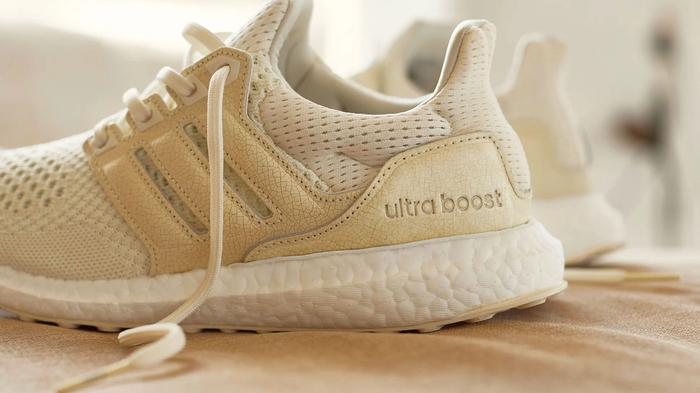 END. x adidas Ultraboost OG 1.0 "Ceramic Craze" product image of a light cream knitted sneaker with a cracked textured cage.