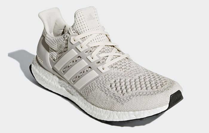 adidas Ultraboost 1.0 product image of a light cream knitted sneaker with a white Boost midsole.