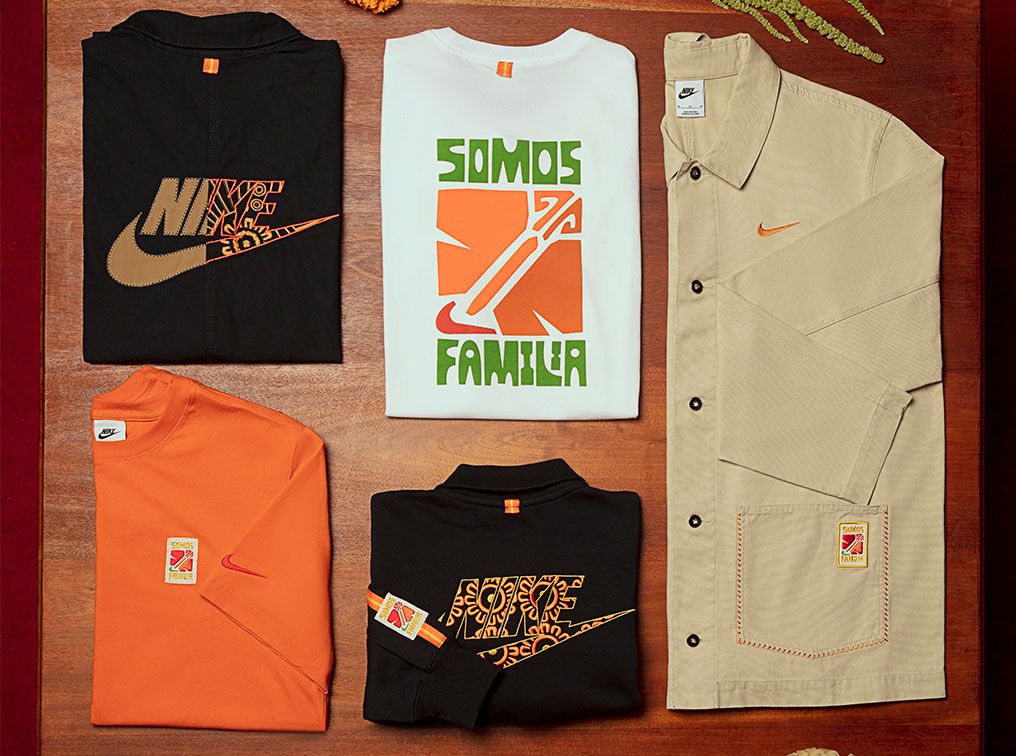 Nike "Somos Familia" apparel product image of a collection of black, white, and orange tees next to a beige shirt.