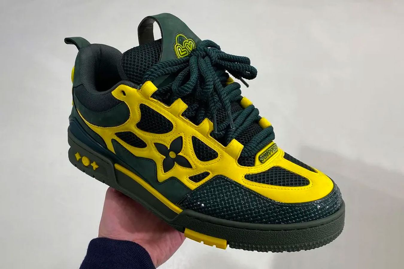 Louis Vuitton LVSK8 product image of a green and yellow low-top.