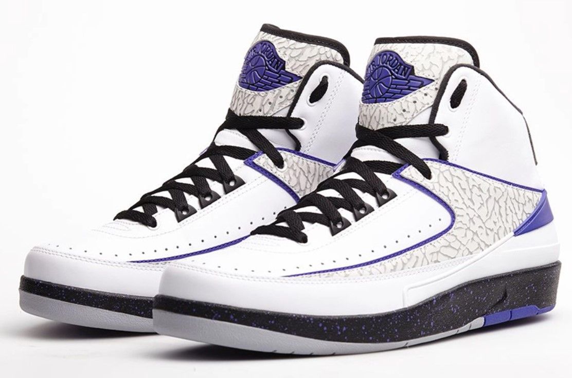 Air Jordan 2 "Dark Concord" product image of a white sneaker with black and purple accents.