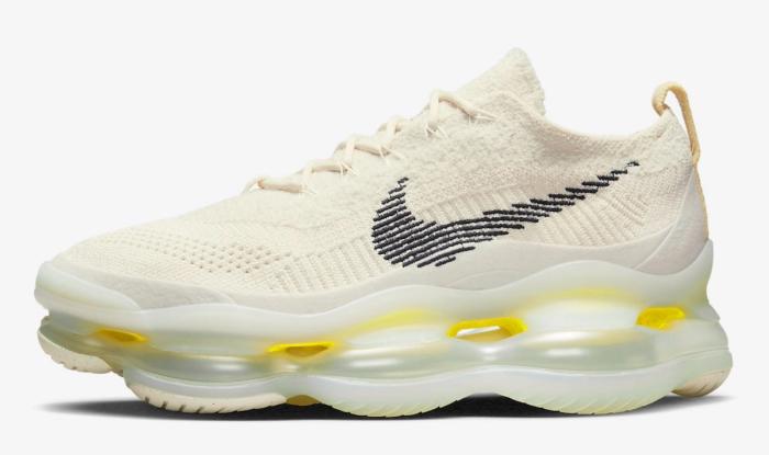 Best sneakers for fall Nike Air Max Scorpion product image of a light cream and lemon wash sneaker with black Swooshes.