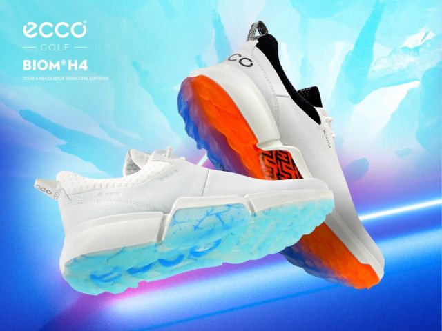 Latest golf shoe news Ecco product image of two white shoes with orange and blue soles.